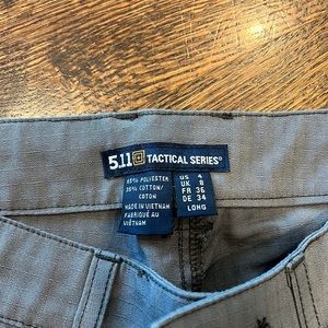 5.11 tactical pants, long.  Never worn.  Smoke free home.  Dark grey